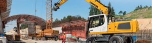 Liebherr a 924 wheeled excavator in action, showcasing versatility in material handling and earthmoving.