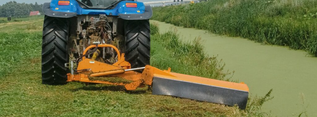 Alamo Roadmaster flail mower in action, cutting through heavy vegetation with precision and power